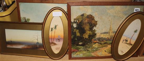 A pair of oval watercolours of desert scenes and prints, largest 40 x 31cm